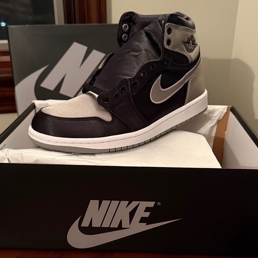 Nike women's Air Jordan one retro high OG Black and Silver Sneakers